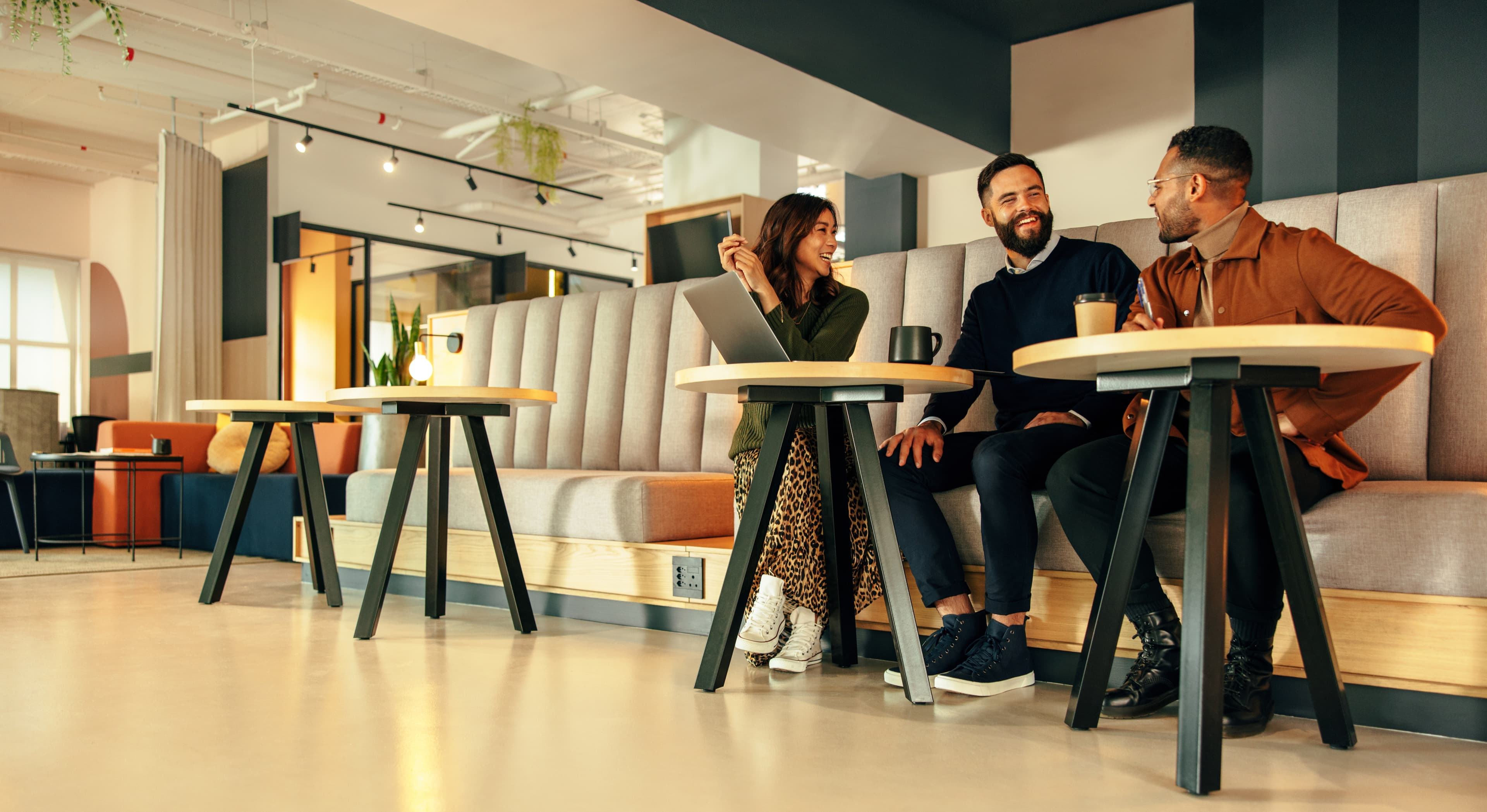 Professionals talking in a flexible workspace